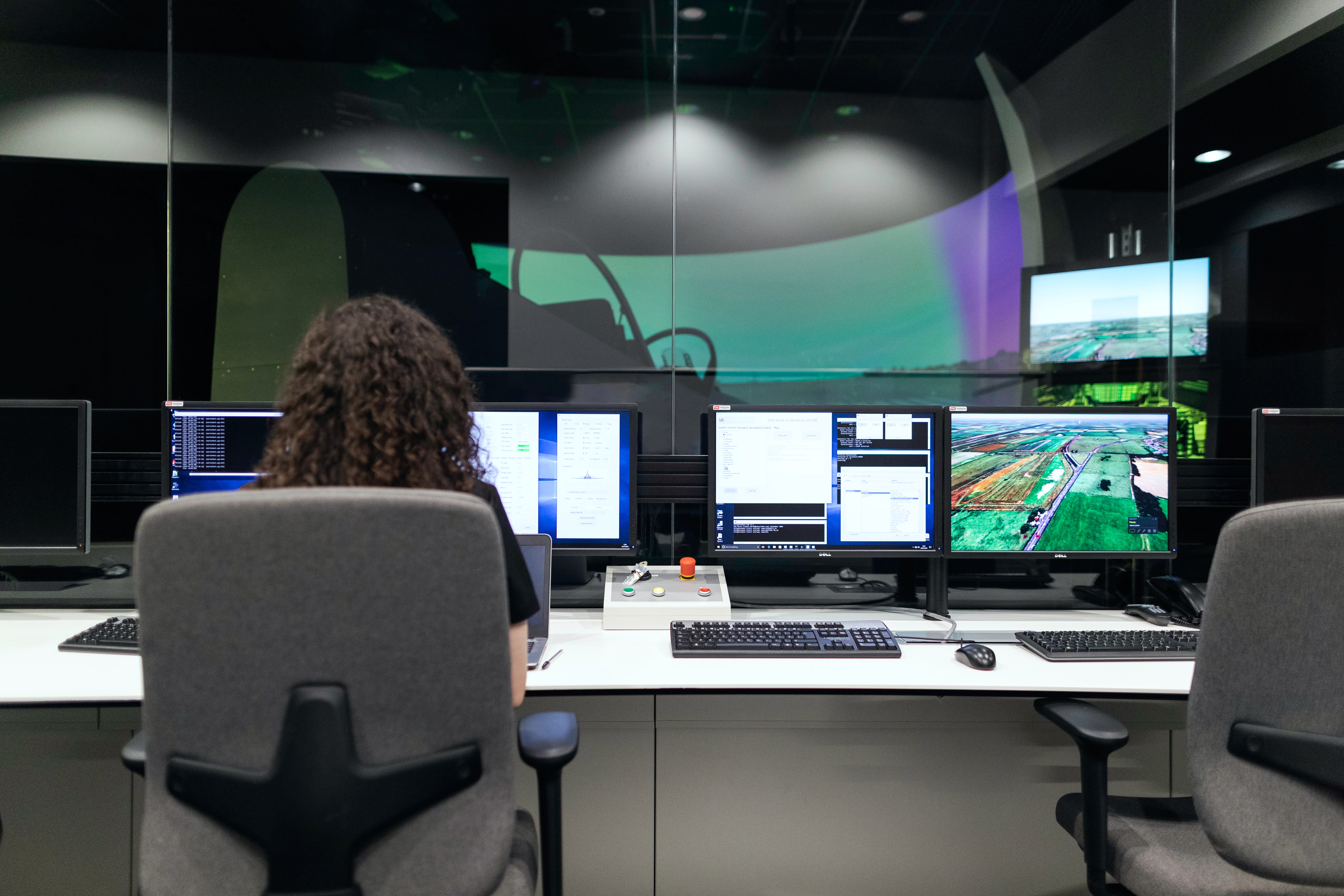 developers looking at a screen and discussing software benefits